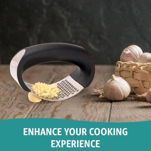 Garlic press rocker, crusher, mincer tool stainless steel with a Garlic Peeler, spatula, and Brush extract more Garlic Paste. The Garlic Mincer Tool Squeezes, Extracts, Crushes 5