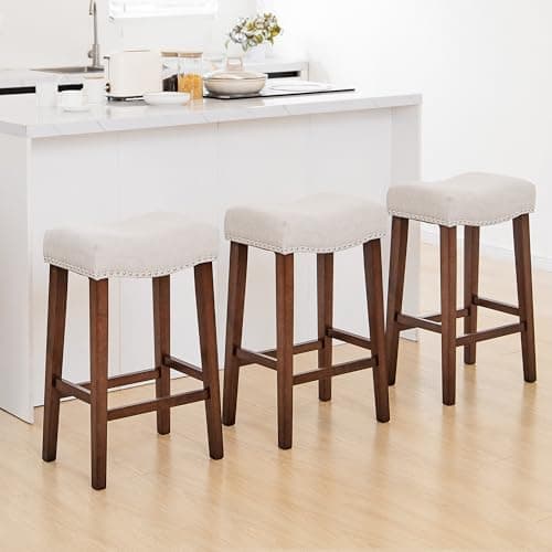 PrimeZone Counter Height Bar Stools Set of 3-26 Inch Backless Saddle Barstools with 4.3" Thick Upholstered, Nailhead Trim Linen Fabric & Solid Wood Legs, Counter Stools for Kitchen Island, Beige