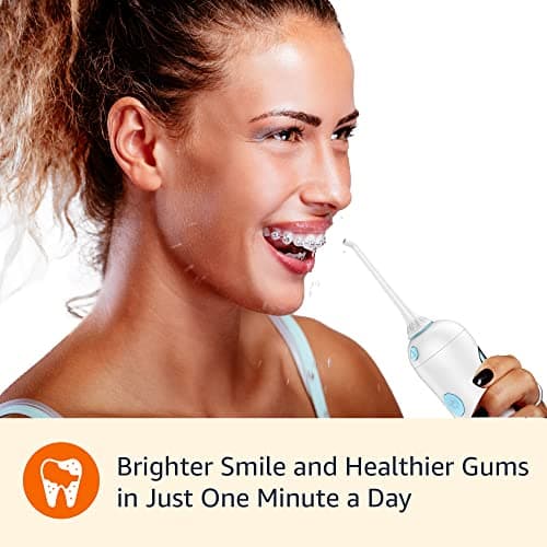 Amazon Basics HydroClean Portable Cordless Water Flosser for Teeth and Gums, 2 Pressure Tips, Removable Tank, 30 Seconds Water Capacity, 2 AA Batteries Included 5